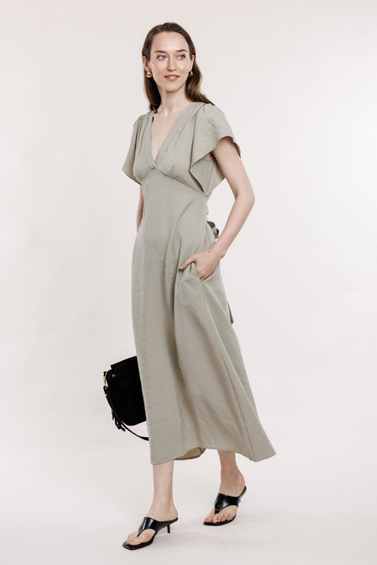Light gray-green dress with a large shoulder
