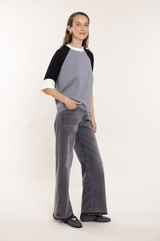 Grey jeans with straight legs.