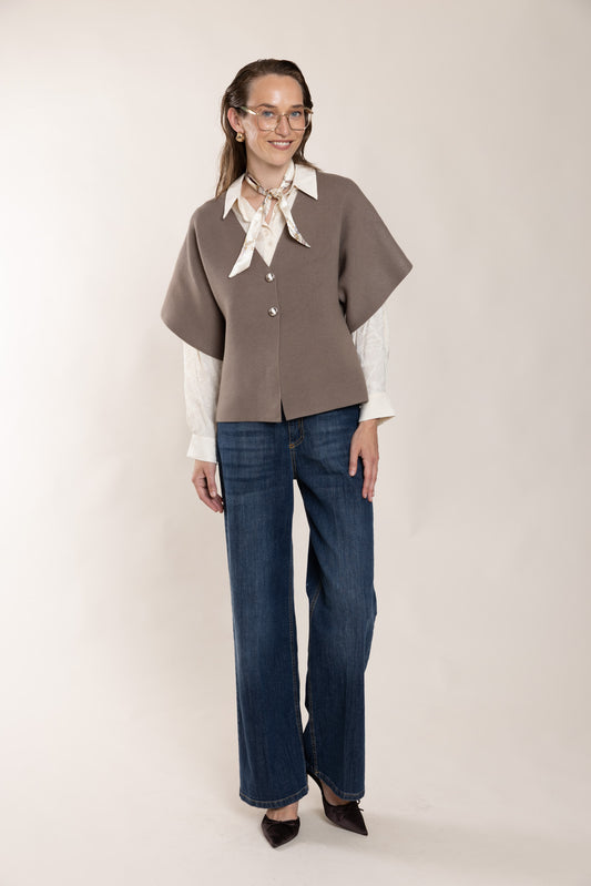 Dark blue jeans with straight legs.