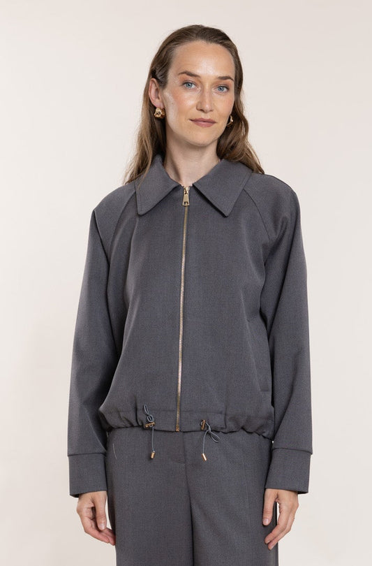 Classic fabric bomber jacket in a pinkish-grey shade.