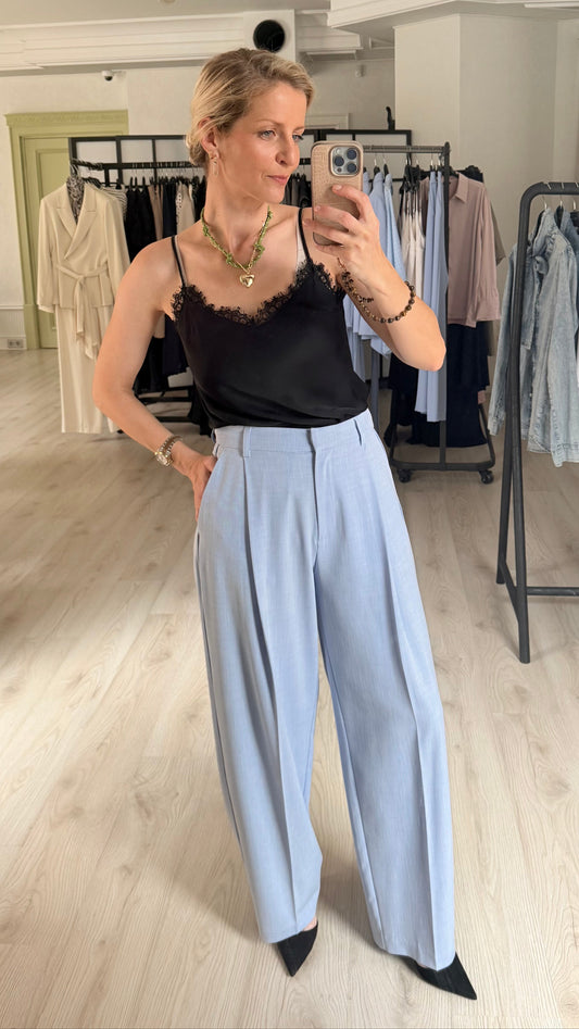 Classic pleated trousers in light blue
